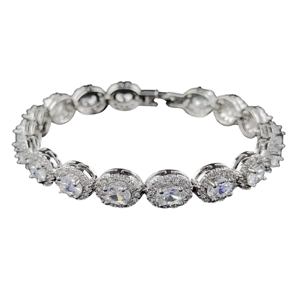 Silver bracelet with clear gemstones on a white background